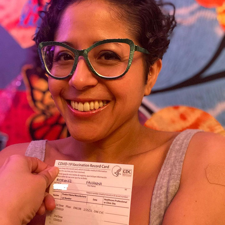 Favianna and her vaccine card.