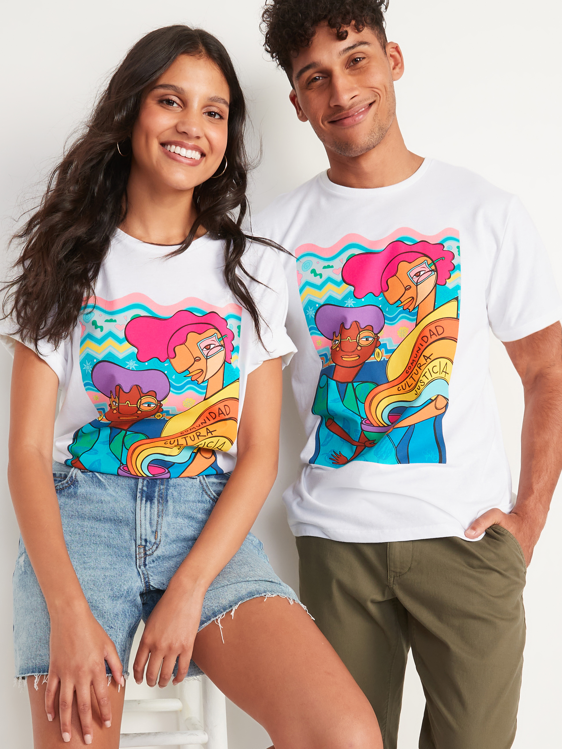 A young woman and a young man modeling Favianna's tees